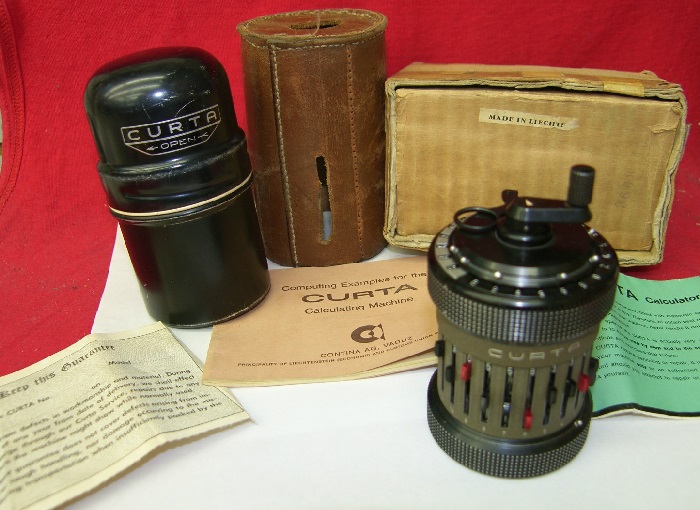 Curta Type II with Instructions, Container, Box and leather case (source ebay)